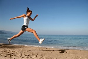 healthy-toned-body-woman-running-on-the-beach
